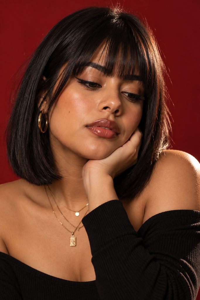 Blunt bob with full bangs, a bold medium length haircut idea